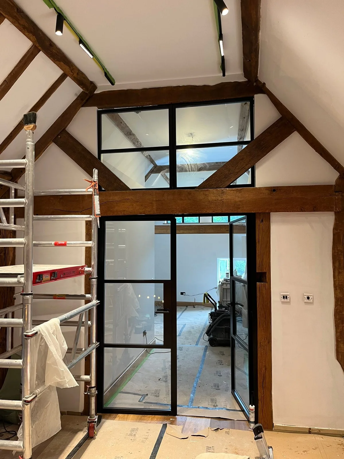 Renovation with black framed internal glazing
