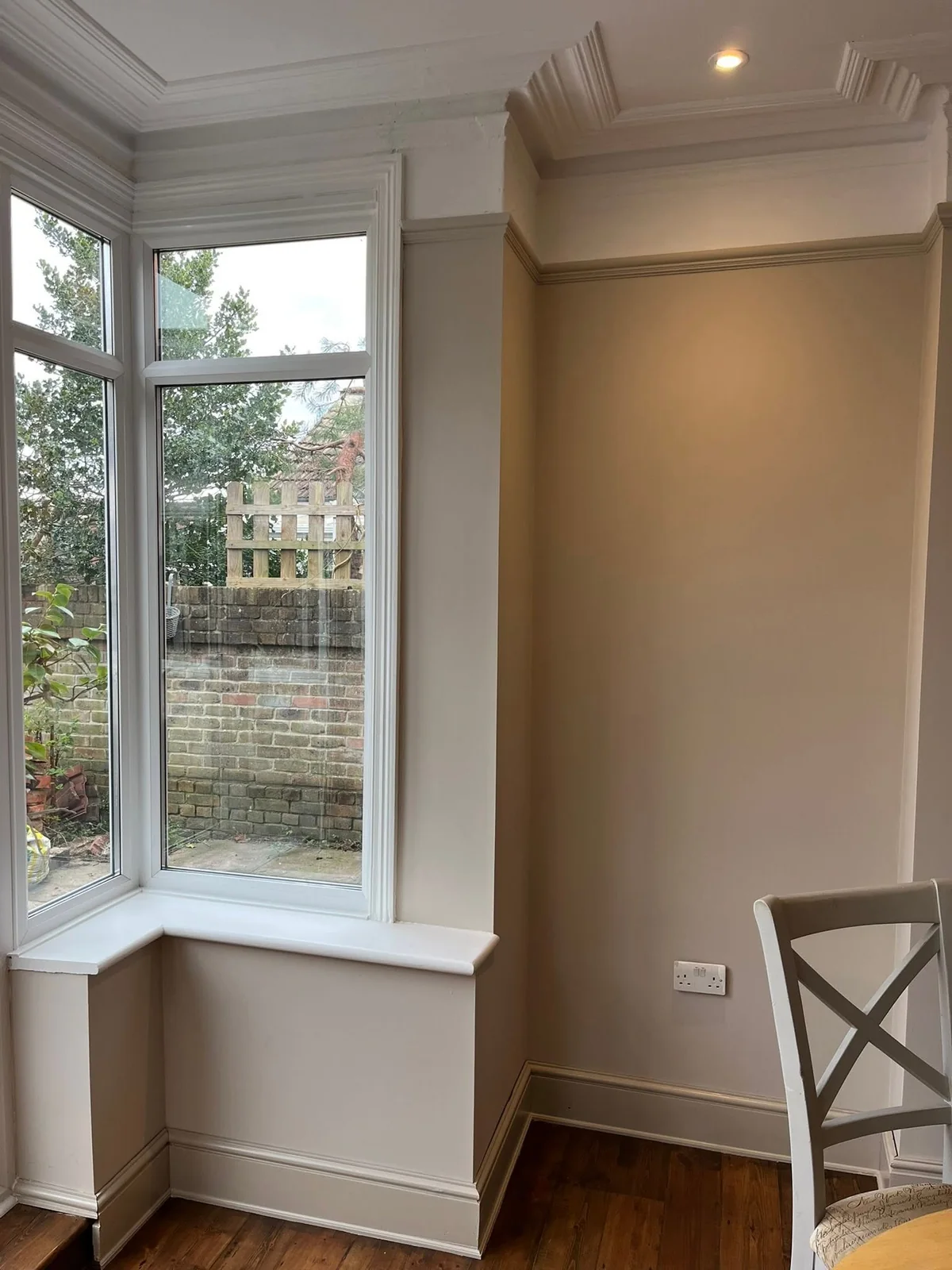 Exposed timber beams and freshly finished walls