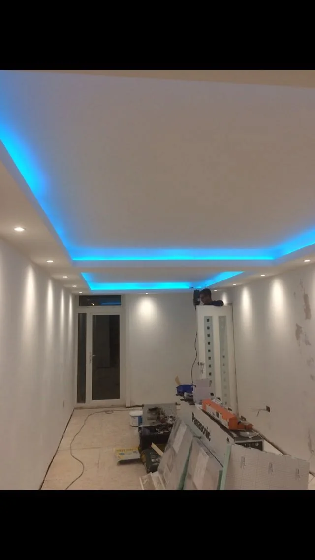 Fresh plaster finish around fireplace and decorative cornice