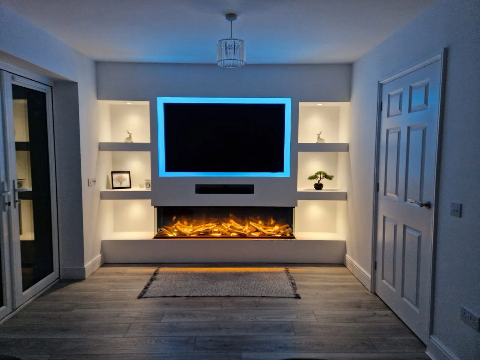 Bespoke media wall with fireplace and display alcoves